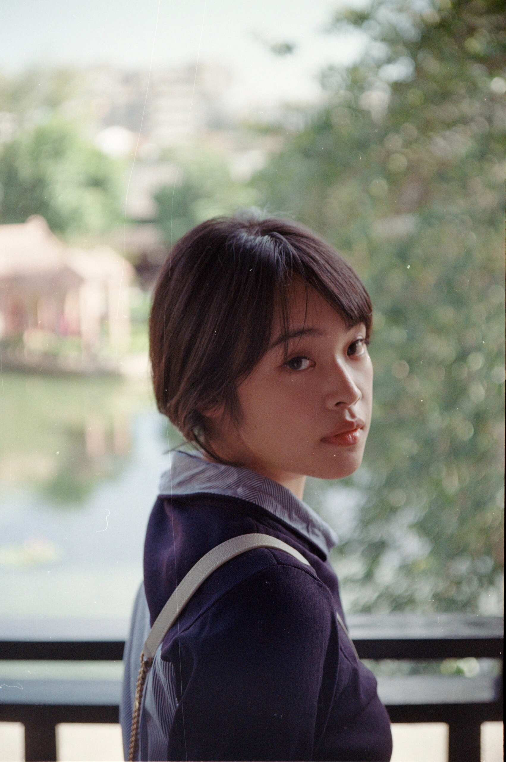Portrait — warm skin, creamy bokeh