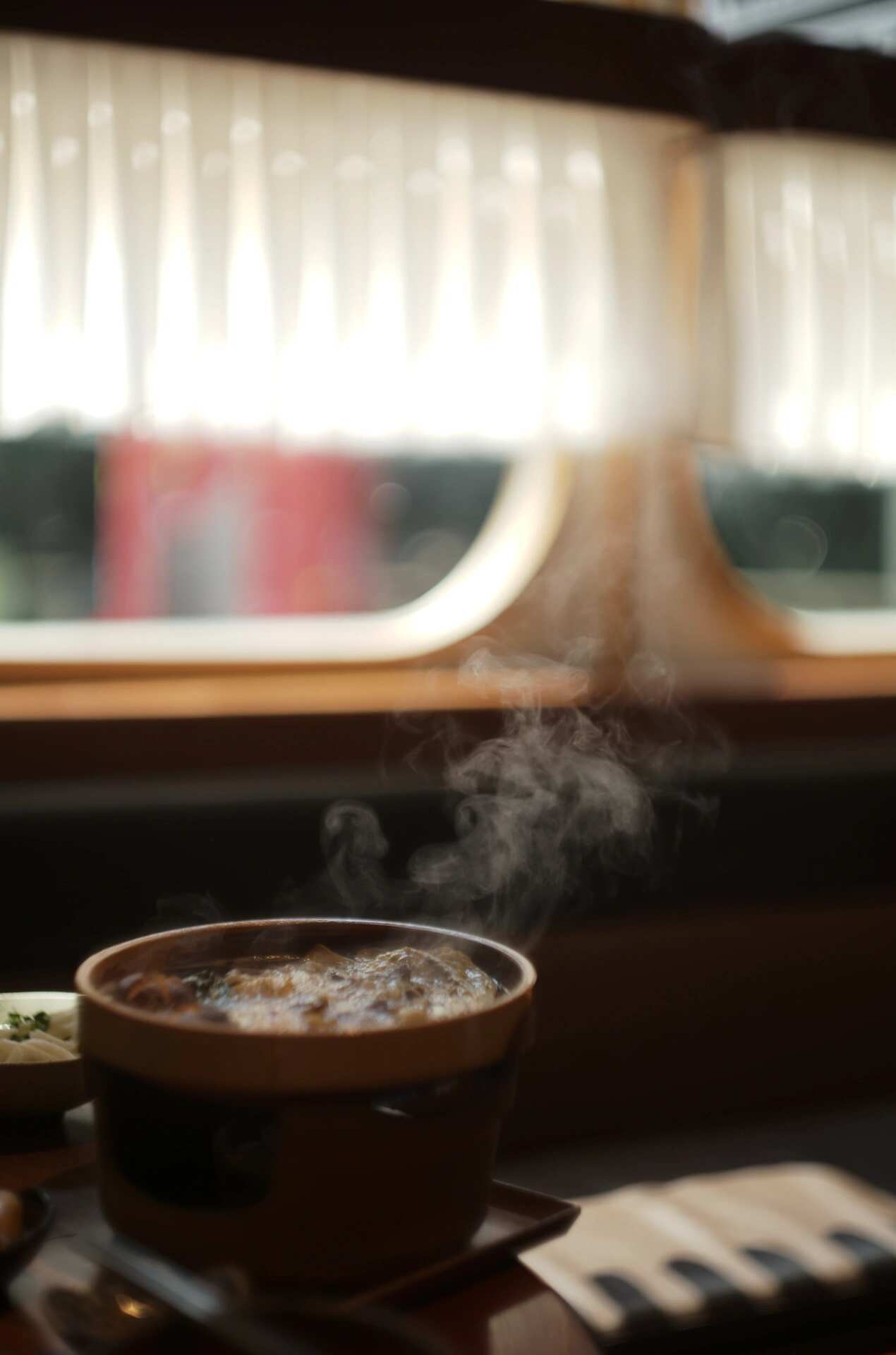 Steaming bowl — glowing highlights and soft haze